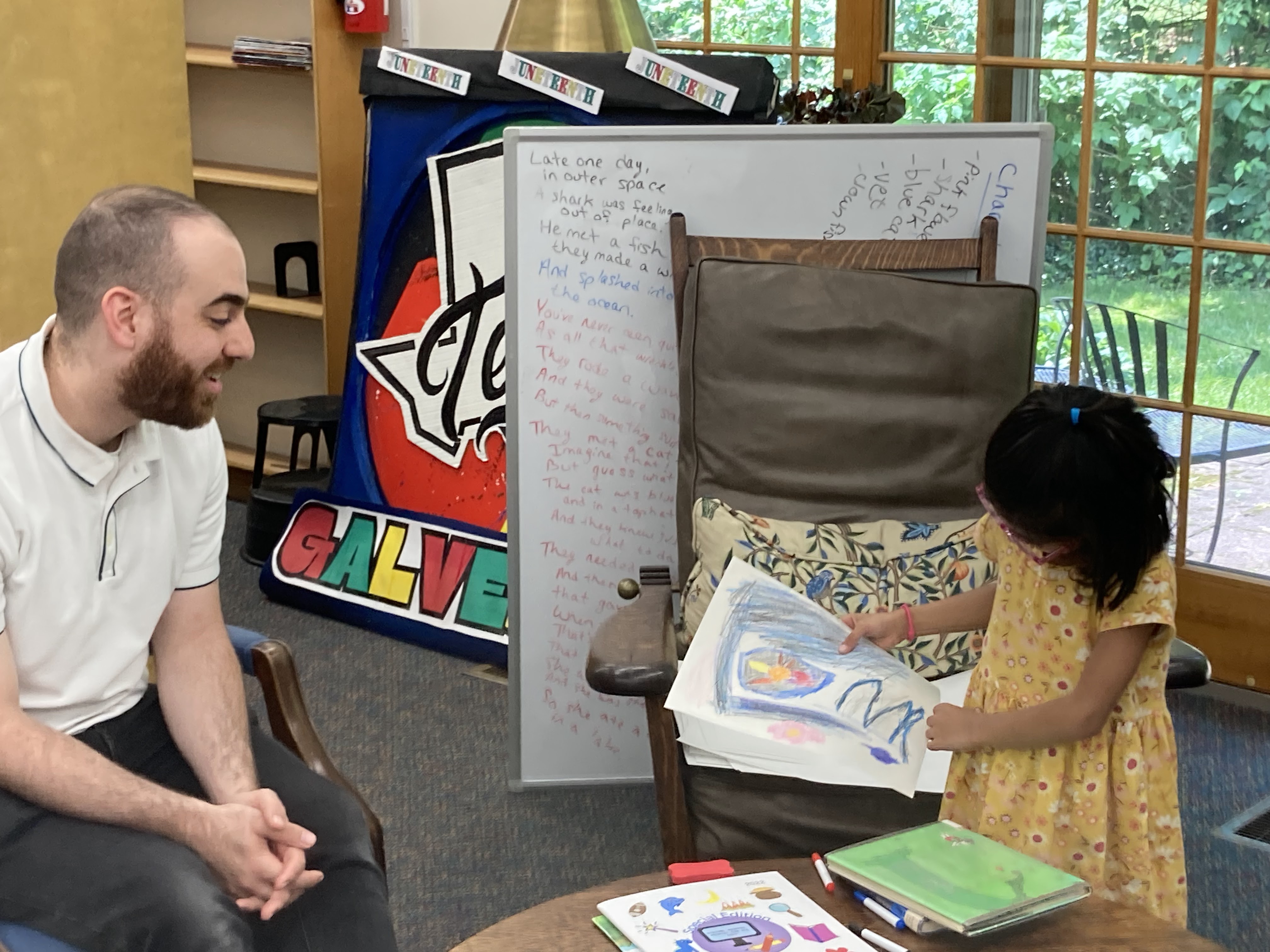 Child showing a drawing