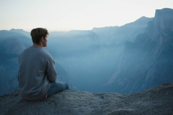 Man looking across mountains