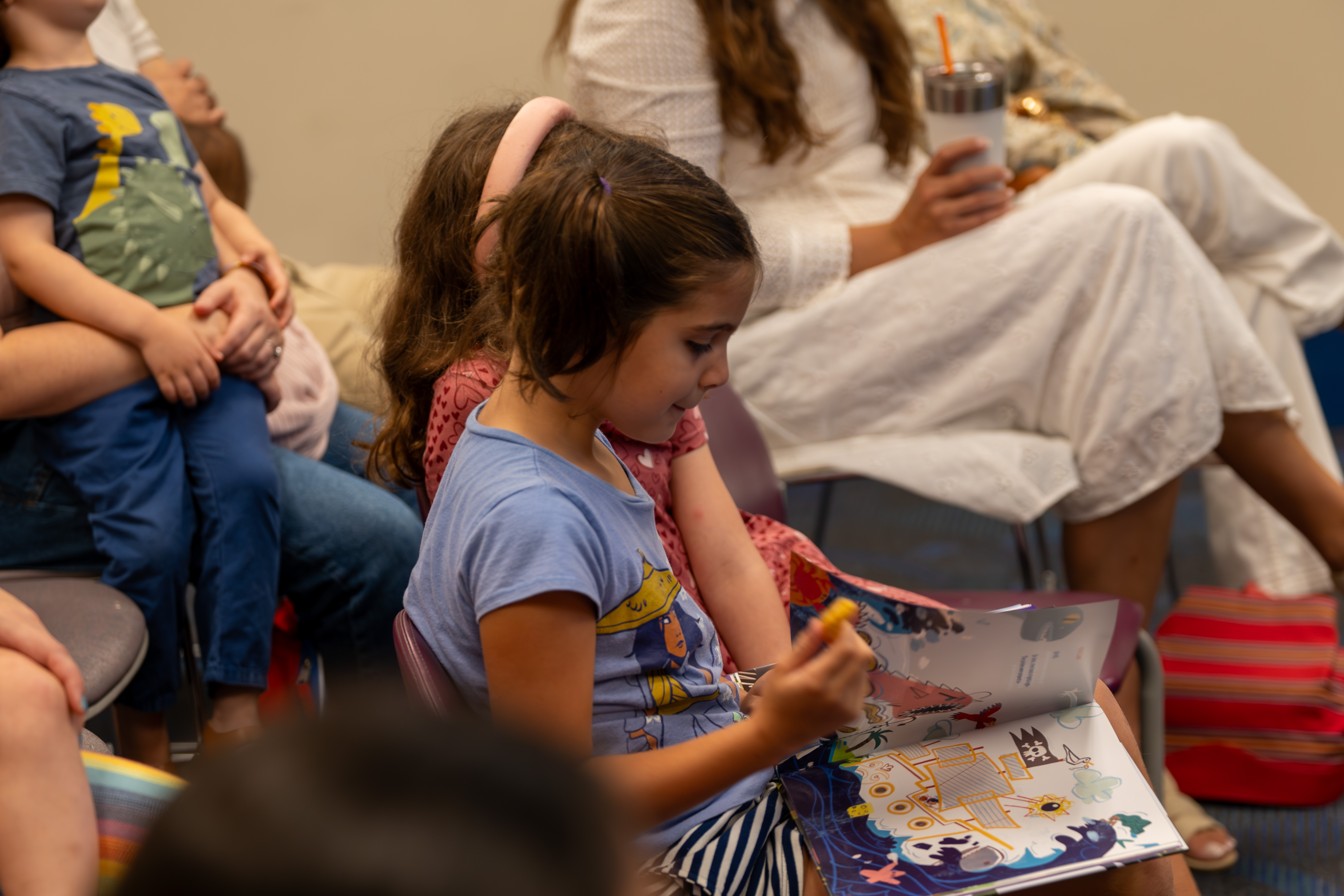 A child reads The Book That Almost Rhymed