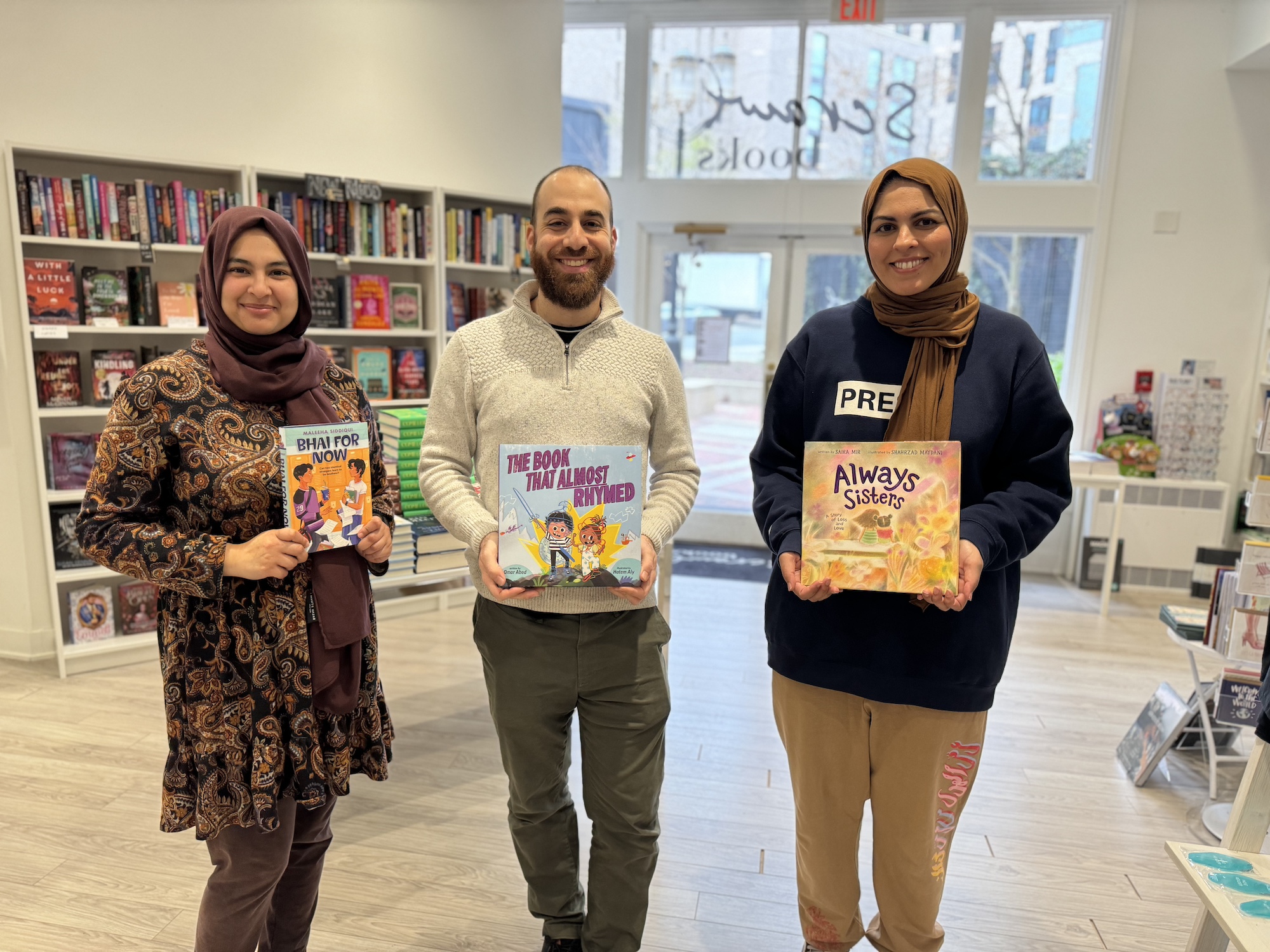 Omar posing with other kidlit authors