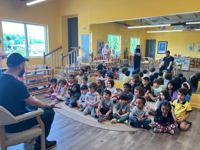 Omar talking to children at Medina Montessori