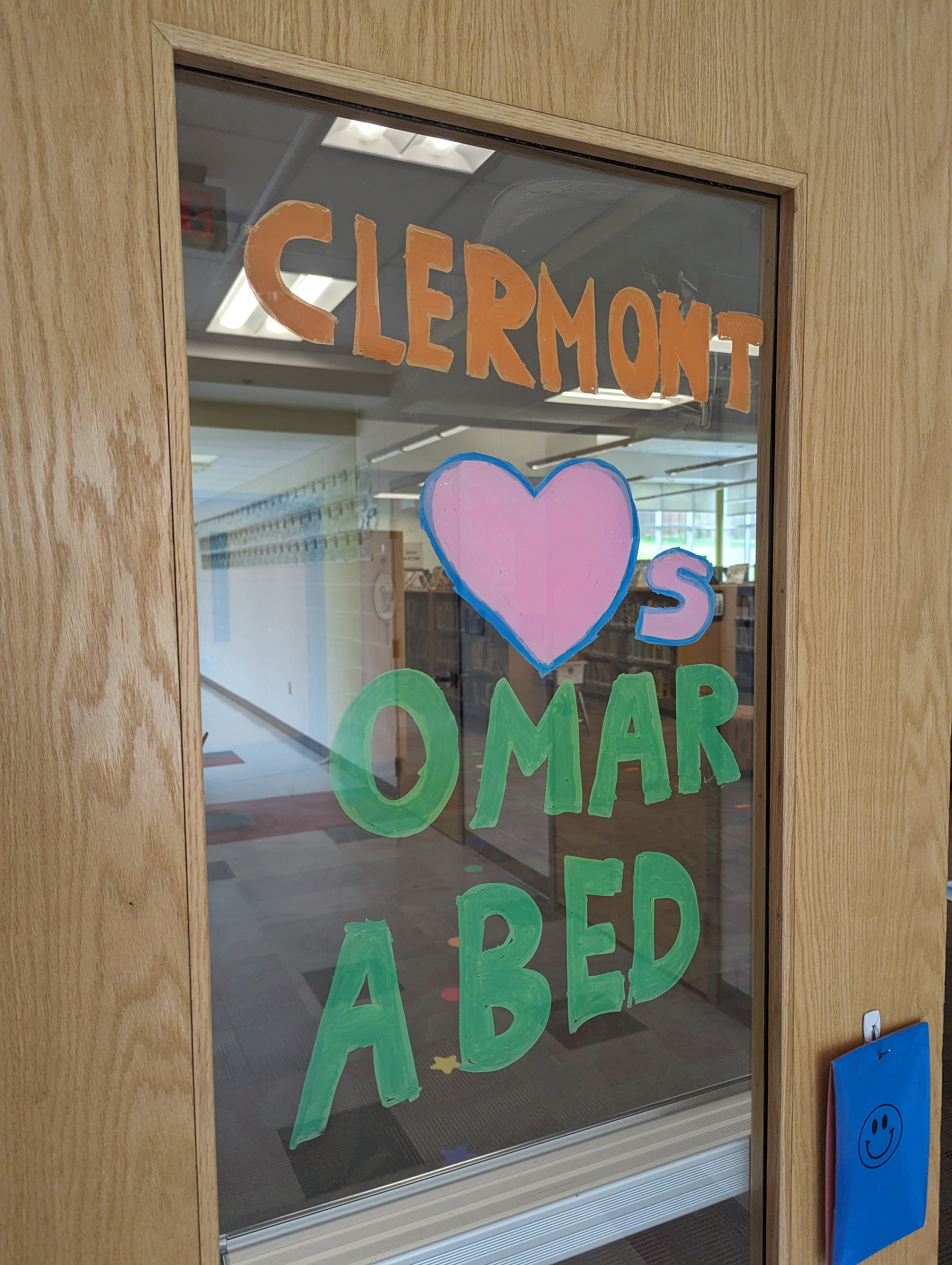 Art on a door at Clermont Elementary reads "Clermont Loves Omar Abed"