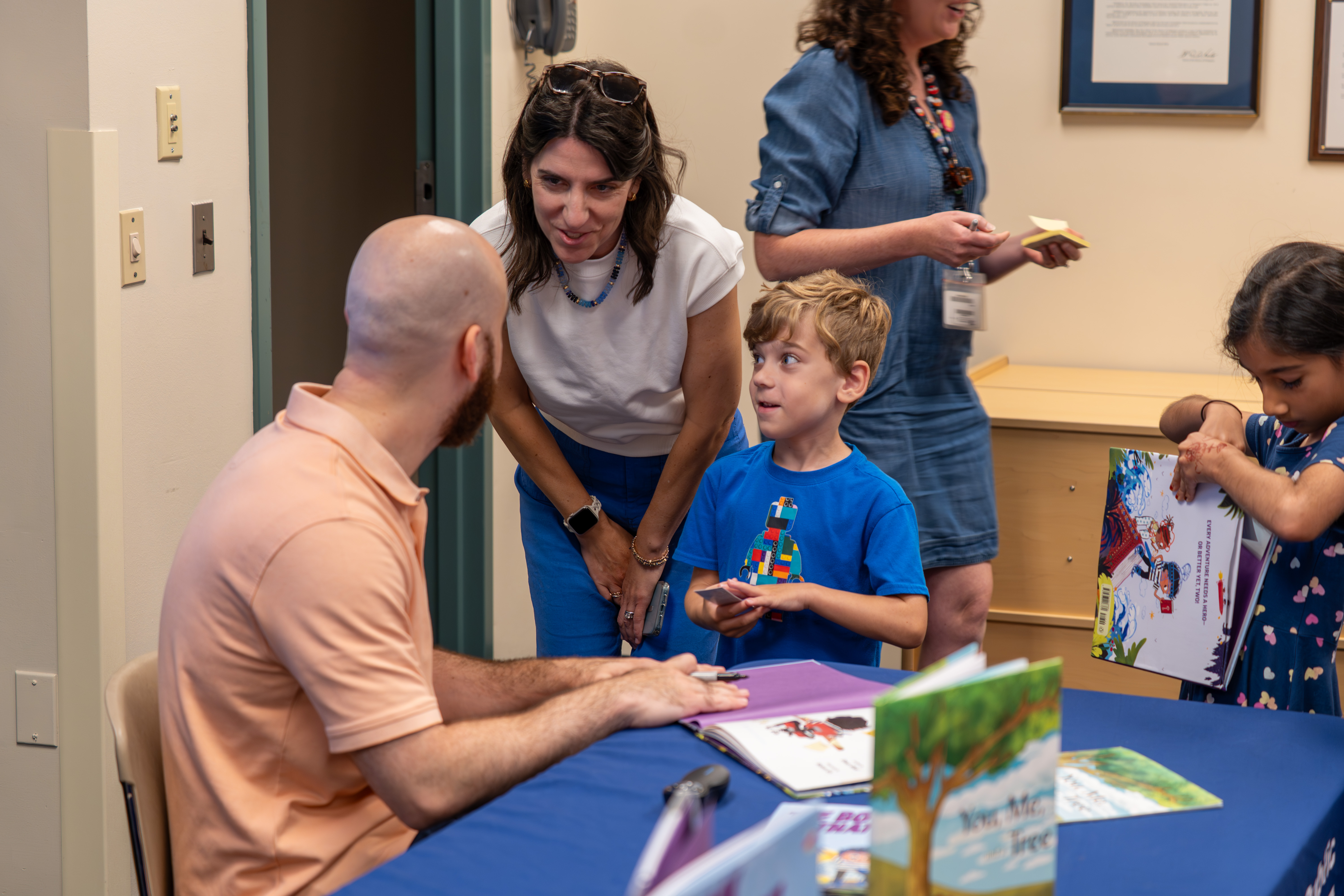 Omar signing books