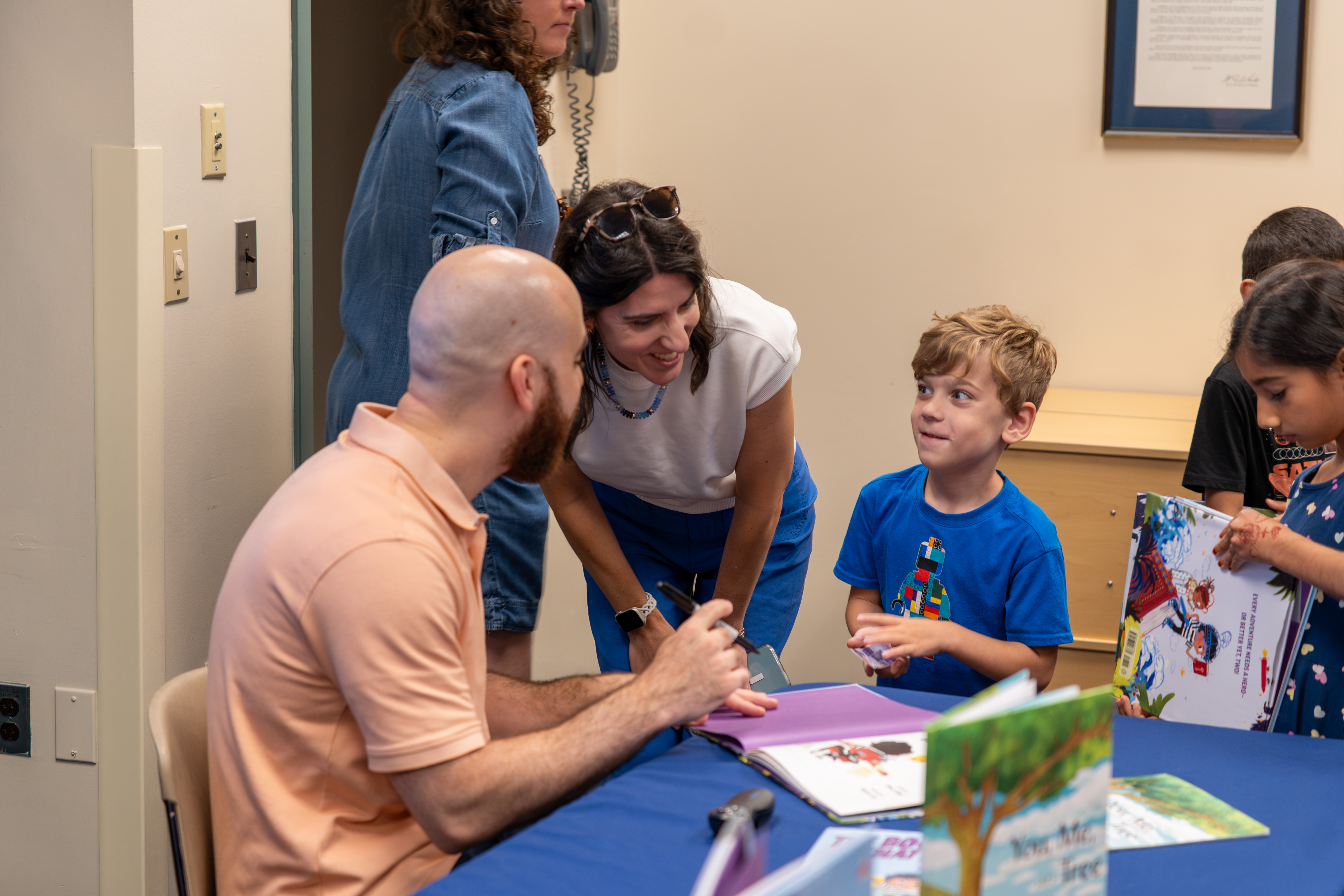 Omar signing books